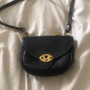 A small black Dooney & Bourke bag